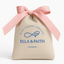 Horse Shoe Gold CZ Stud Earrings – Dainty & Hypoallergenic  in a branded gift pouch by Ella & Faith with a pink ribbon.