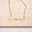 Gold necklace with 'Antonette' pendant on a beige background. Personalised Name Necklace ā 18K Gold-Plated
Waterproof | Hypoallergenic | Made-to-Order