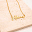 Gold necklace with 'Abena' pendant on a beige stone surface. Personalised Name Necklace – 18K Gold-Plated
Waterproof | Hypoallergenic | Made-to-Order