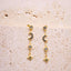 Moon & Star Drop Earrings ā Gold  Fine Jewellery | 925 Sterling Silver | Midnight Blue CZ Stones, on a beige background