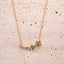 Gold necklace with star and moon pendant on a beige stone surface- Moon & Star Necklace – 14K Gold Over 925 Silver, CZ Gemstones
Celestial Charm | CZ Gemstones | Hypoallergenic