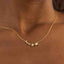 Gold necklace with star and moon pendant on a person's neck against a brown background-Moon & Star Necklace ā 14K Gold Over 925 Silver, CZ Gemstones
Celestial Charm | CZ Gemstones | Hypoallergenic Ella and Faith London