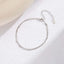 Layered Chain Bracelet ā Silver option on a white fabric