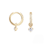 Gold hoop earrings with small crystals on a white background