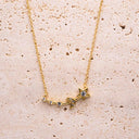 Gold necklace with star and moon pendant on a beige stone surface- Moon & Star Necklace – 14K Gold Over 925 Silver, CZ Gemstones

Celestial Charm | CZ Gemstones | Hypoallergenic