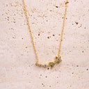 Gold necklace with star-shaped pendant on a beige stone surface Moon &amp; Star Necklace – 14K Gold Over 925 Silver, CZ Gemstones

Celestial Charm | CZ Gemstones | Hypoallergenic