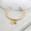 Acorn and leaf charm detail on 18K gold plated sterling silver bangle