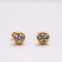 Mini CZ Stud Earrings – 4mm Gold PVD Stainless Steel featuring round cut cubic zirconia in a bezel-style frame.