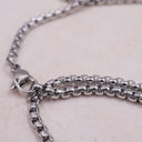 Close-up of The Lord’s Prayer Cross Necklace showing engraved prayer text and cut-out cross detail