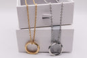 Two Minimal Circle Pendant Necklace one gold and one silver, on a white background.
