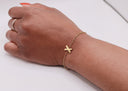 Gold Initial Bracelet worn on a wrist showcasing the elegant design in PVD gold stainless steel.