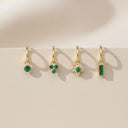 Emerald Charm Clicker Hoop Earrings featuring four gold hoops with emerald gems.