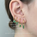 Emerald Charm Clicker Hoop Earrings featuring removable emerald charms including drop, trio, bee, and bar.