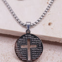 Engraved cross necklace featuring the Lord's Prayer on a circular stainless steel pendant with cut-out cross design.
