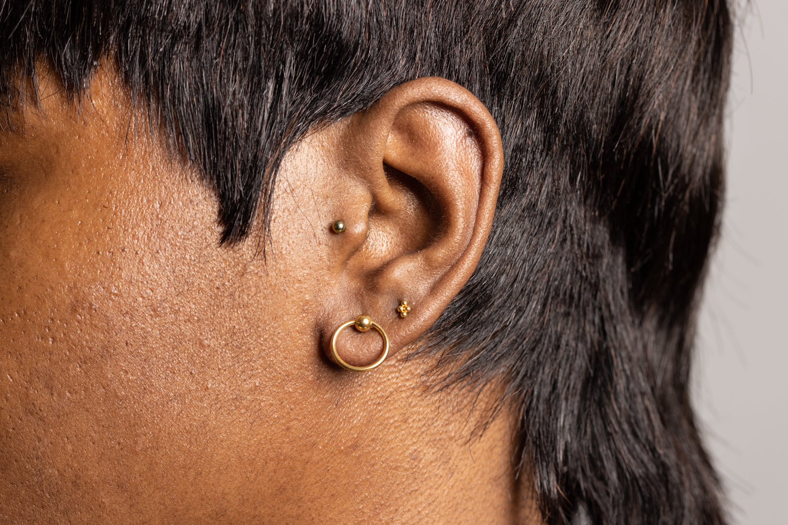 Flatback barbell cartilage hoop – hypoallergenic internally threaded earring by Ella and Faith London.