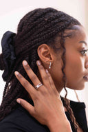 Removable Charm Huggie Hoop Earrings on a model 