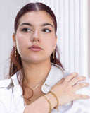 Custom Name Bracelets Gold – Waterproof & Tarnish Free-Woman wearing gold jewellery against a white background.