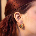 Sculpted Pearl-Embellished Hoops, Close-up of a person wearing Sculpted Pearl-Embellished Hoops  with a blurred background
