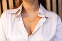 Person wearing a gold necklace with engraved name on a white shirt. Personalised Name Necklace – 18K Gold-Plated

Waterproof | Hypoallergenic | Made-to-Order