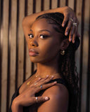 Woman with braided hair posing against a wooden background wearing Gold Twisted Hoop Earrings – 18k Plated Sculptural Hoops

Twisted Elegance | 18K Gold-Plated | Hypoallergenic | Ella and Faith London