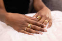 Close-up of hands with gold rings on a soft surface Close-up of hands wearing Moonstone Solitaire Ring – 14K Gold-Plated Silver Pearl & CZ

Art Deco-Inspired | Moonstone, Pearls & CZ | Hypoallergenic