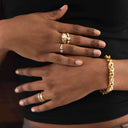 Close-up of hands wearing Celestial Dot Band Ring – Gold Plated & Sterling Silver and a gold bracelet.