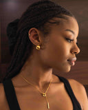 Woman wearing gold earrings and necklace with a blurred background. Gold Dome Hoop Earrings – 18k Plated Hypoallergenic Dome Hoops

Bold Curves | 18K Gold-Plated | Hypoallergenic
