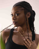 Woman with braided hair wearing a black top and gold necklace against a neutral background- Moon &amp; Star Necklace – 14K Gold Over 925 Silver, CZ Gemstones

Celestial Charm | CZ Gemstones | Hypoallergenic