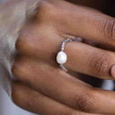 Elasticated pearl ring with sterling silver bead worn on hand, easy on and off everyday jewellery