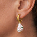Model wearing Baroque Pearl Drop Huggie Hoops – 14K PVD Gold | Waterproof &amp; Hypoallergenic