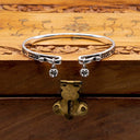 Close-up of a person's wrist with s925 Sterling Silver Bell Bangle – Handmade & Adjustable

100% 925 Silver | Adjustable Fit | Hypoallergenic
