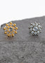 Close-up of push-fit titanium earrings in gold & silver, perfect for cartilage, tragus, and conch piercings. Hypoallergenic & waterproof for sensitive skin.