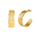 A pair of gold huggie hoop earrings with an embossed leaf pattern, shown on a plain white background.