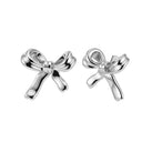 Silver bow-shaped earrings on a white background