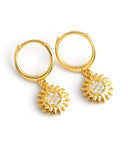 Mini Gold Huggie Hoop Earrings with Sunflower Charm on a white background