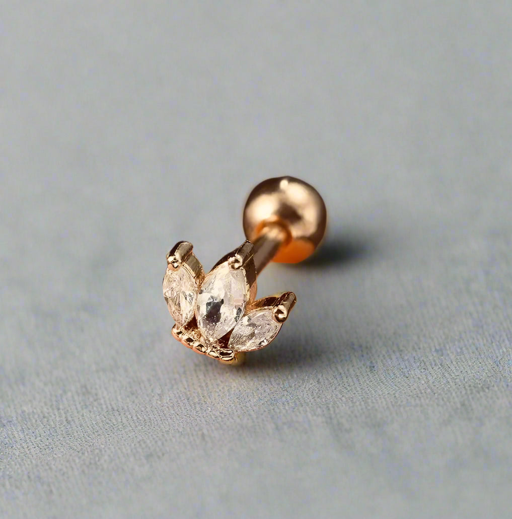 Gold lotus piercing stud – hypoallergenic tragus & cartilage jewellery by Ella and Faith London.