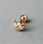 Gold lotus piercing stud – hypoallergenic tragus & cartilage jewellery by Ella and Faith London.